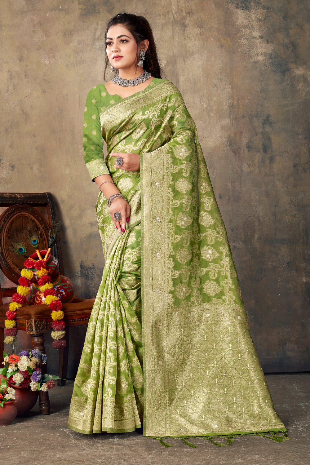 Pastel green embossed vasundhara silk mix saree, contrast zari border of  floral designs & intricate floral design pallu