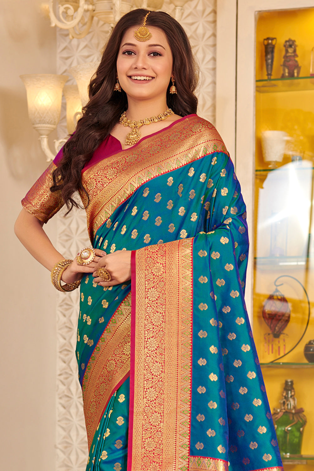 Dark green butter silk saree with zari buttas, zari border & pallu of  floral & geometric patterns