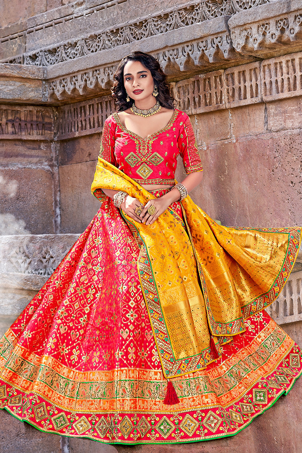 Photo of Red and gold bridal lehenga with yellow dupatta