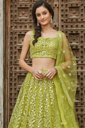 Lime green brocade lehenga with an asymmetrical drape blouse embellished  with handmade floral chains and lehenga draped to resemble the… | Instagram