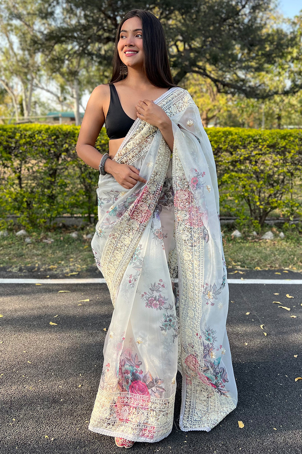 Orange Woven Organza Saree With Tassels